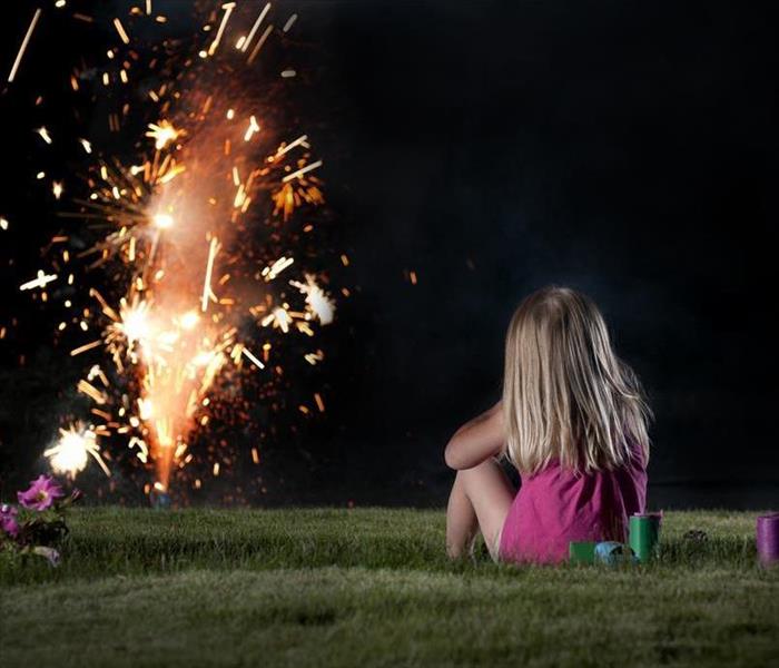 young girl watching fireworks